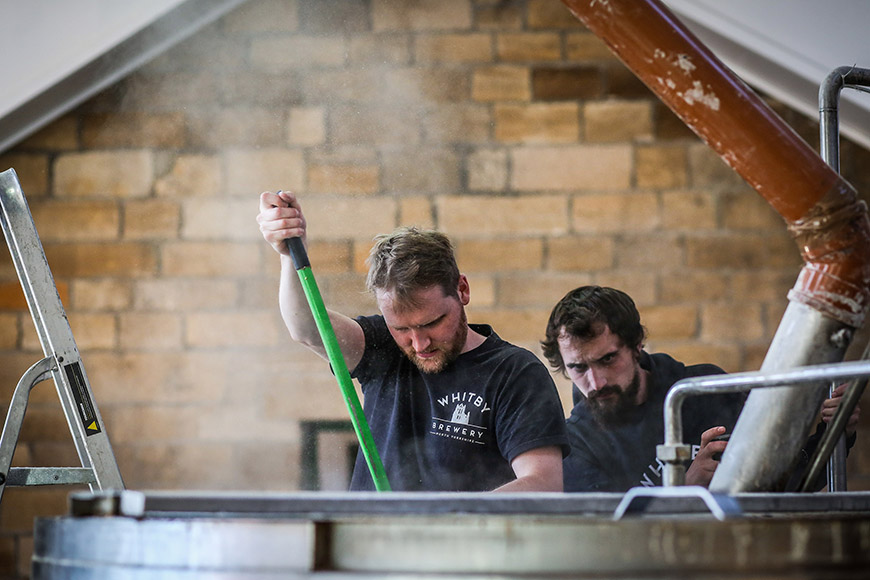 Richard stirring ingredients in a large vat by Ceri Oakes Richard stirring ingredients in a large vat by Ceri Oakes