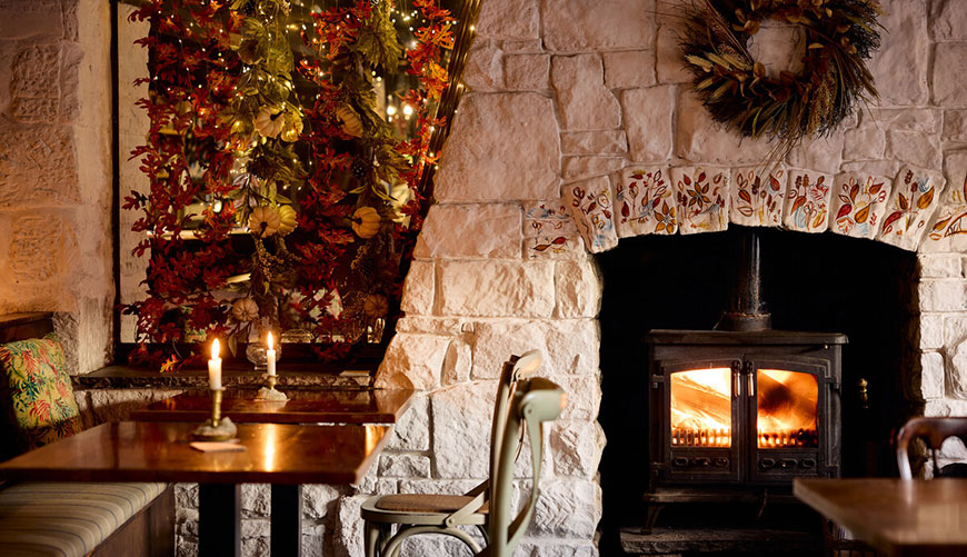 Stone fireplace with log burner