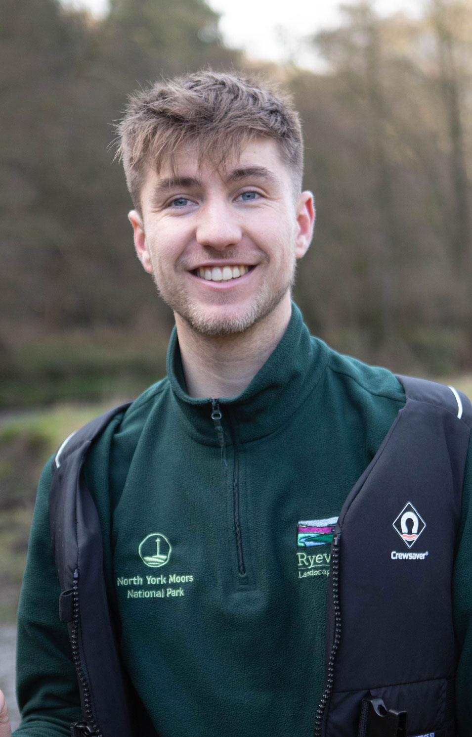 Photo of a young male near a river. Credit Charlie Fox.