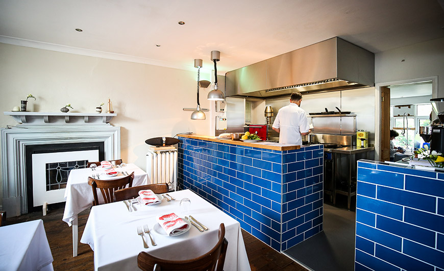 Restaurant and adjacent kitchen by Ceri Oakes Restaurant and adjacent kitchen by Ceri Oakes