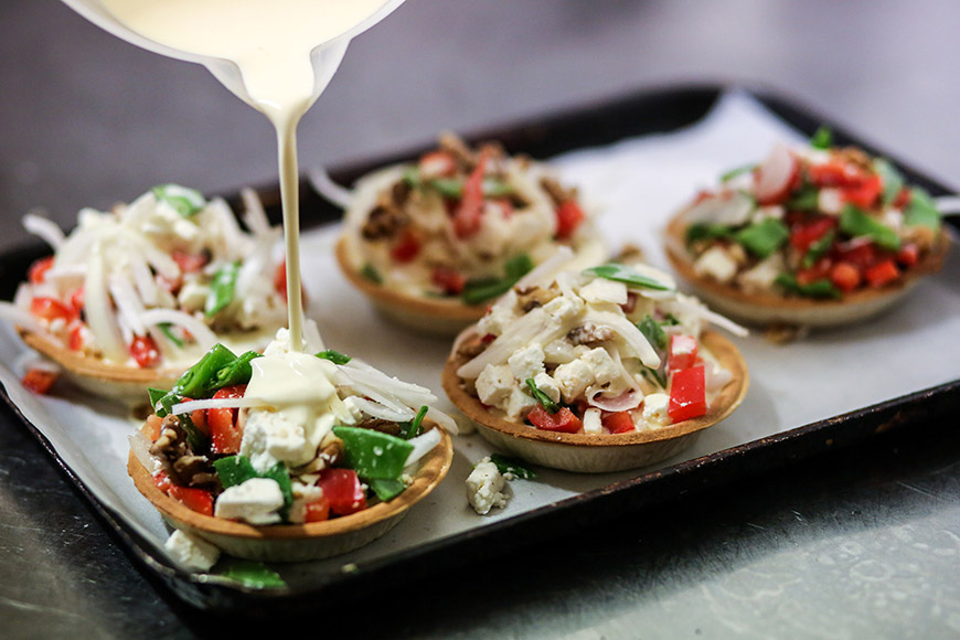 Quiches ready for oven by Ceri Oakes