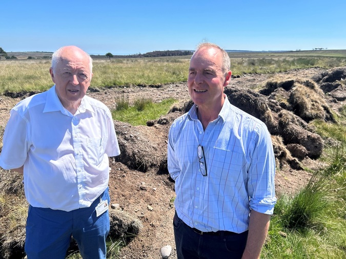 Cllr Carl Les and Jim Bailey of the NYMNPA stand by a firebreak constructed during the 2025 NYM wildfire