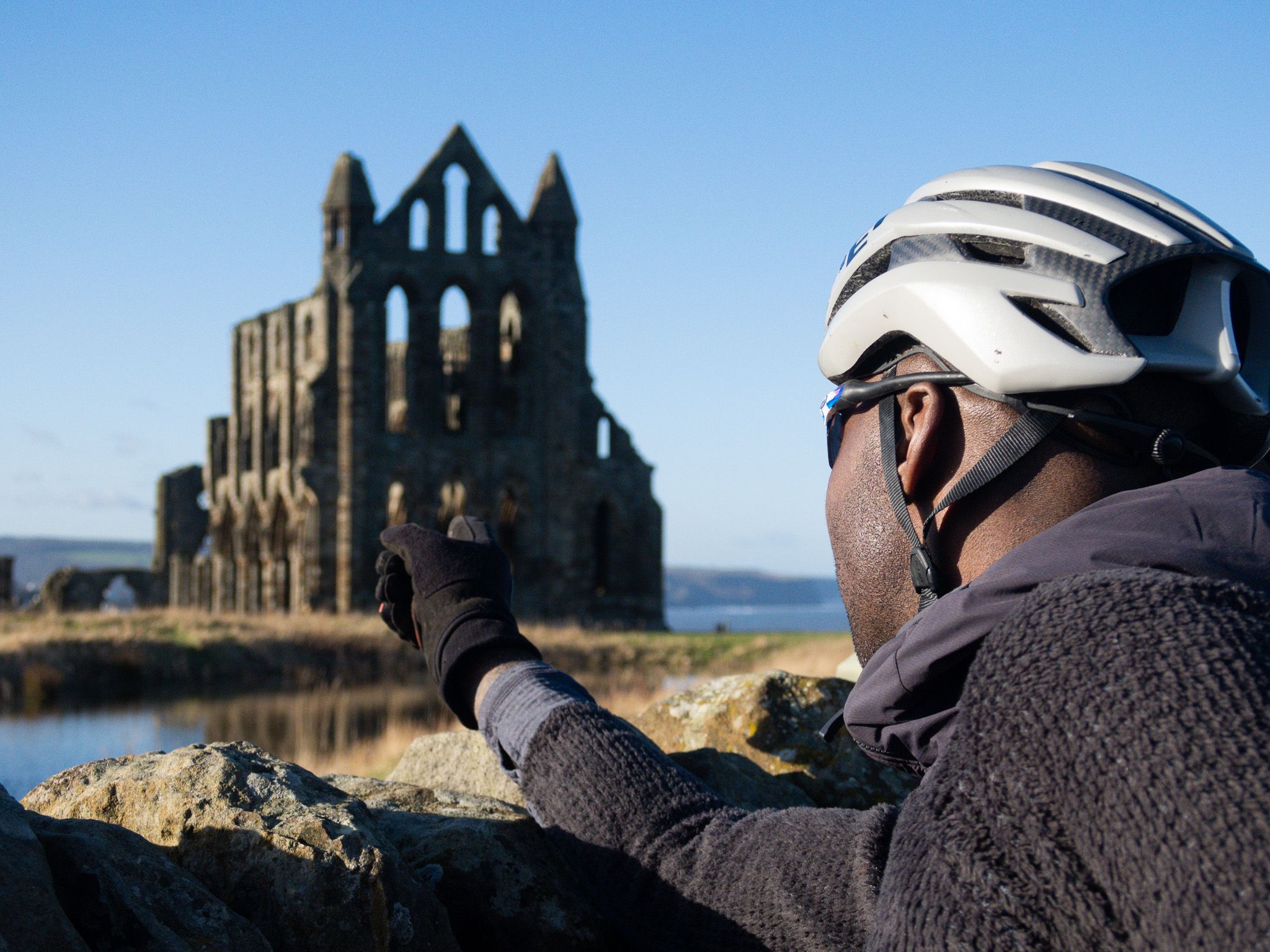 Cyclists pointing at Whitby Abbey credit Markus Stitz