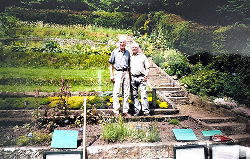 Two men standing in Danby Lodge's garden