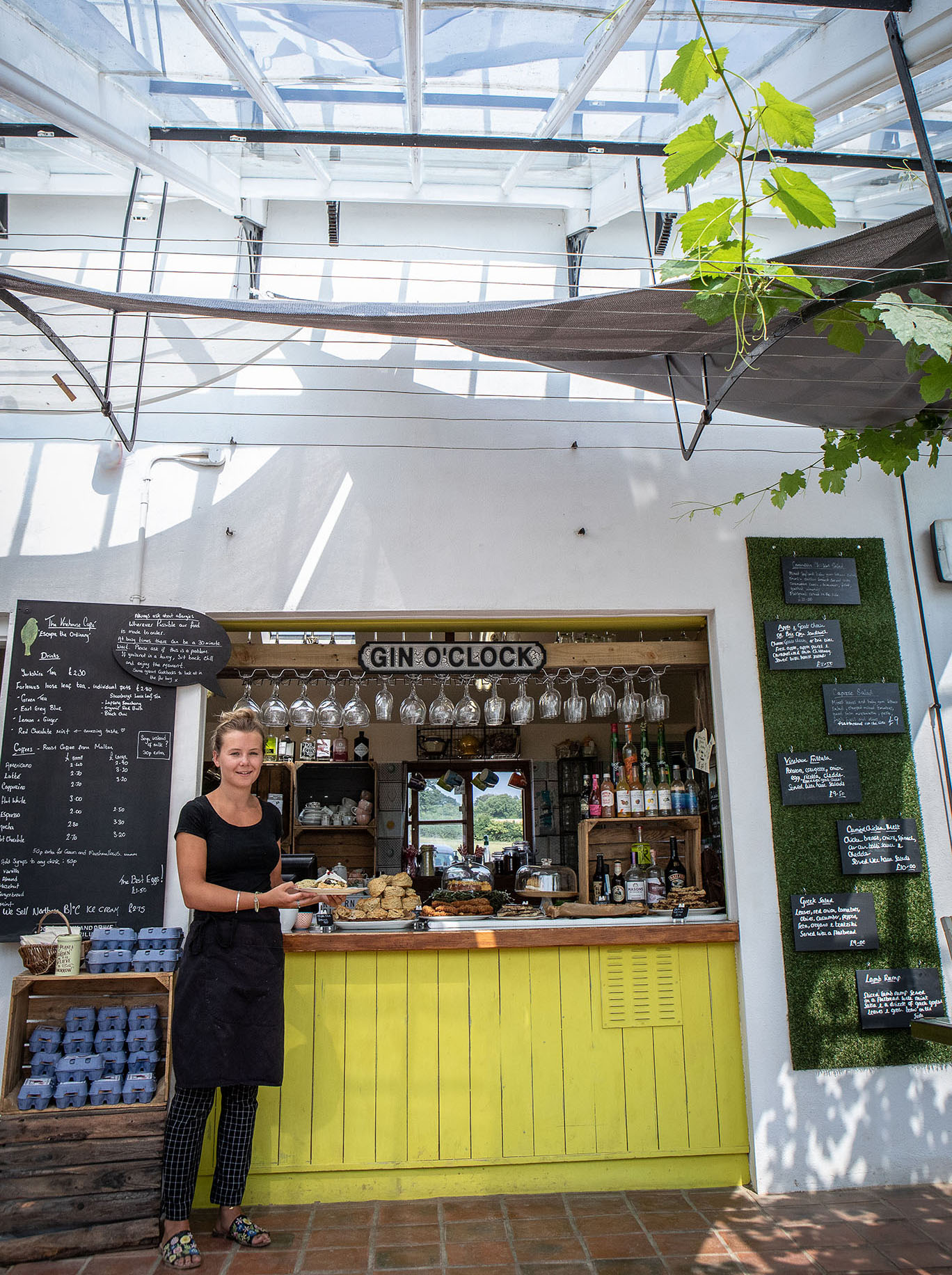 Molly stood at the cafe counter by Polly Baldwin Molly stood at the cafe counter by Polly Baldwin