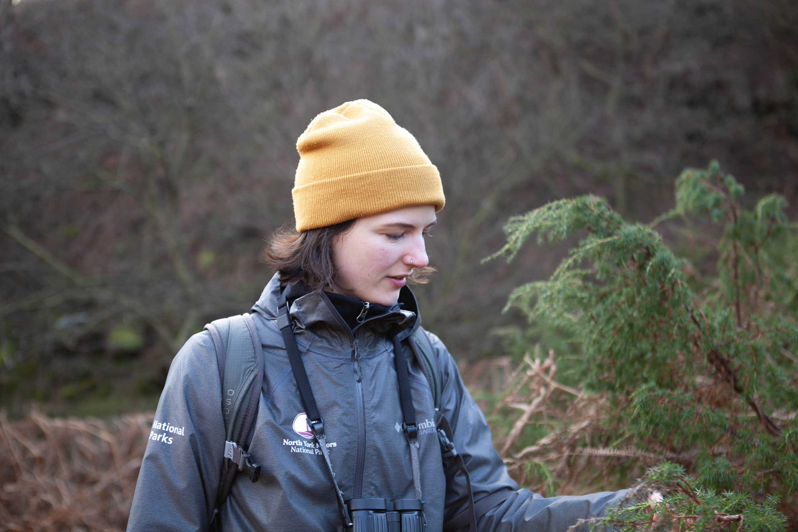 Woman holding a juniper tree. Credit Charlie Fox.