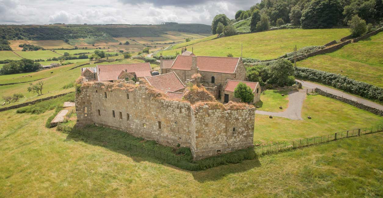 Remains of Danby Castle next to a stone farmhouse. Credit James Hines. Remains of Danby Castle next to a stone farmhouse. Credit James Hines.