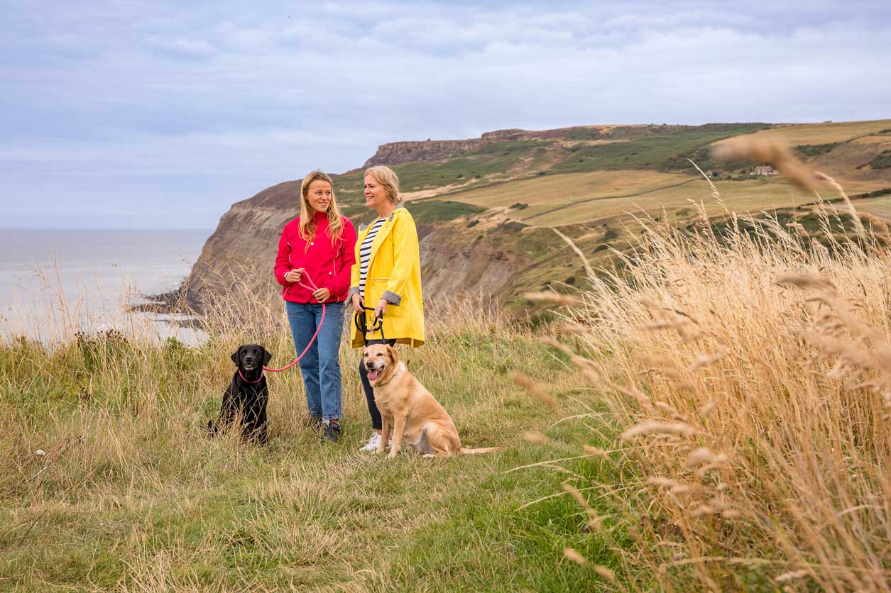 Dog walkers on a coastal path. Credit Dependable Productions.