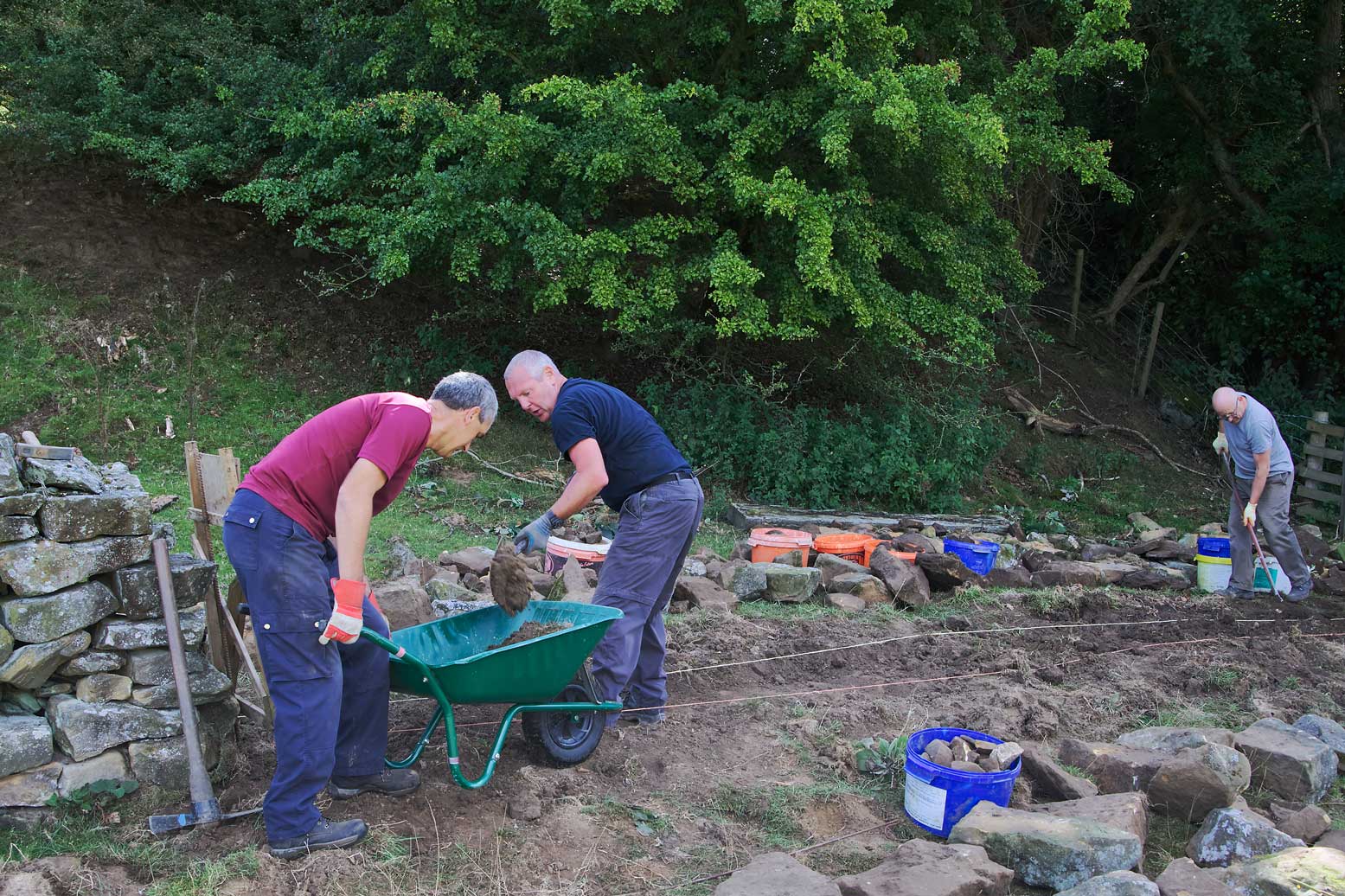 Volunteers carrying out dry stone wall repairs. Volunteers carrying out dry stone wall repairs.