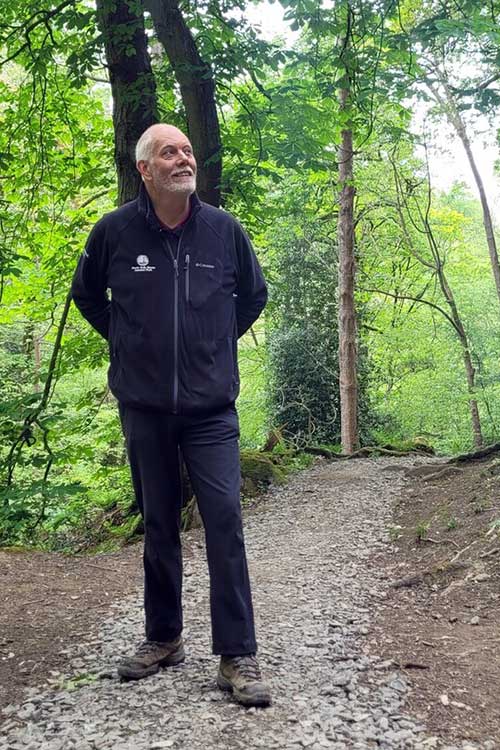 Coast to Coast Project Officer walking through woodland