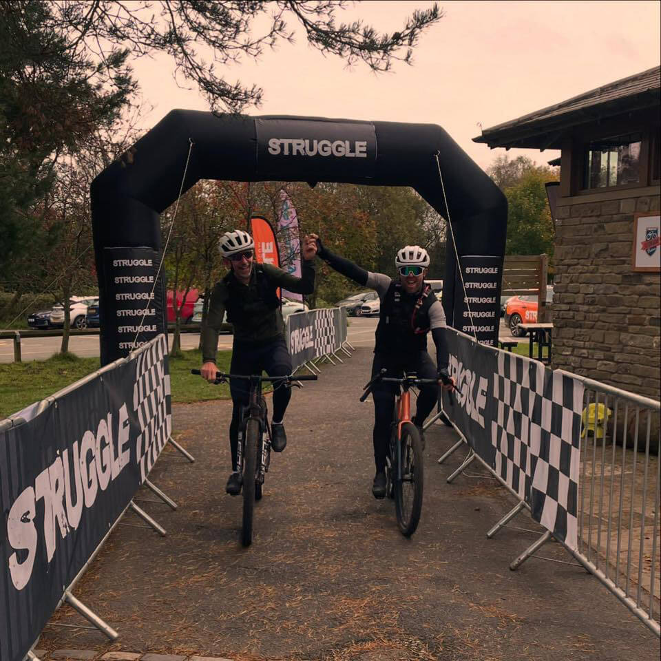Two cyclists completing the Minds and Miles race.