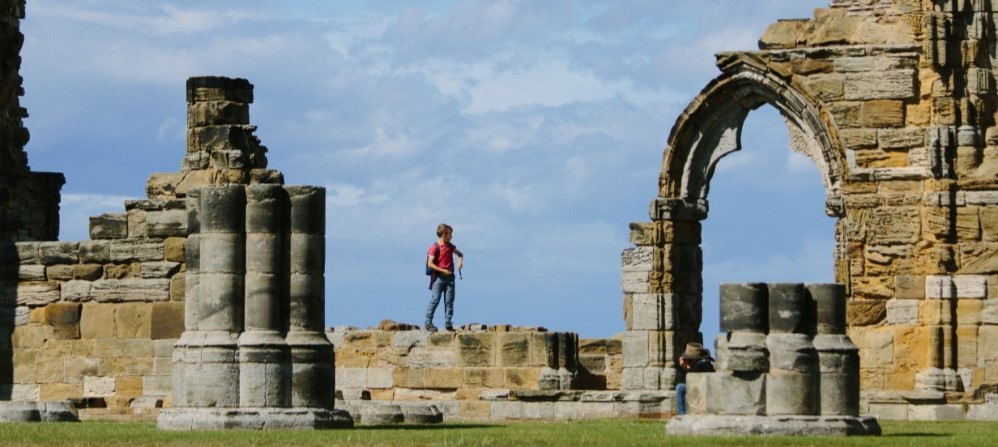 Exploring the ruins - Copyright of English Heritage