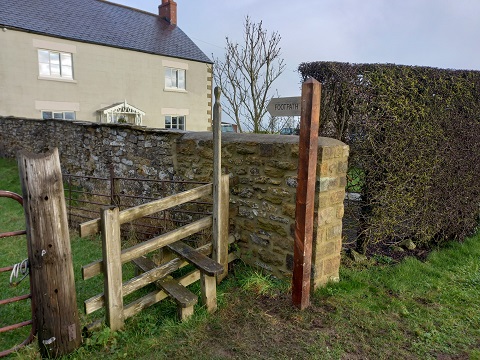 Footpath sign in front of house