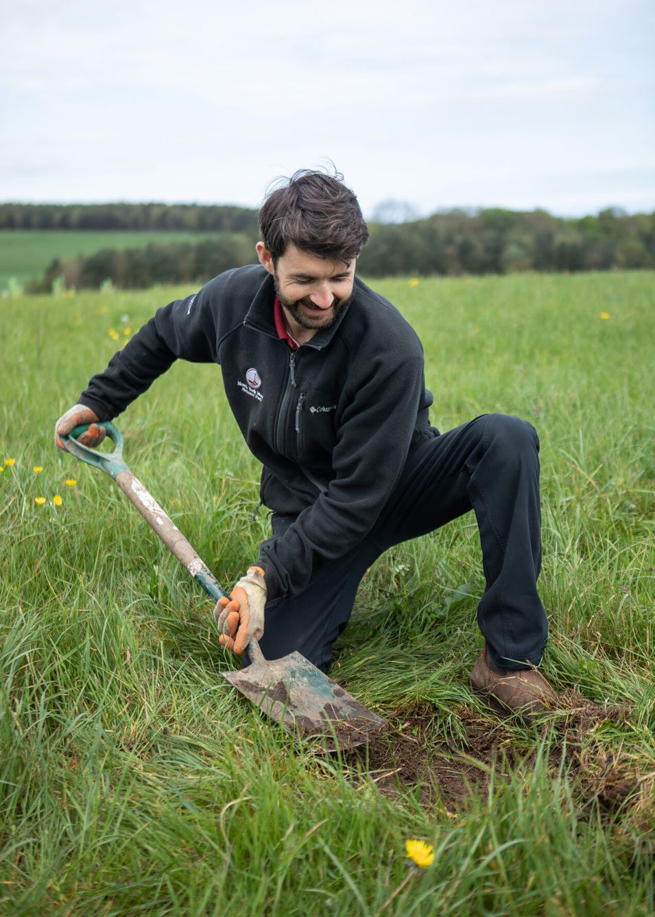 Man digging into soil with a spade in a field. Credit Charlie Fox. Man digging into soil with a spade in a field. Credit Charlie Fox.