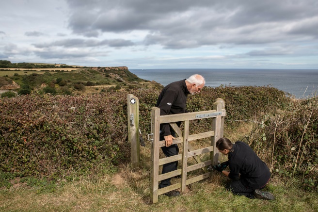Rangers fixing gate along coast. Credit Polly A Baldwin
