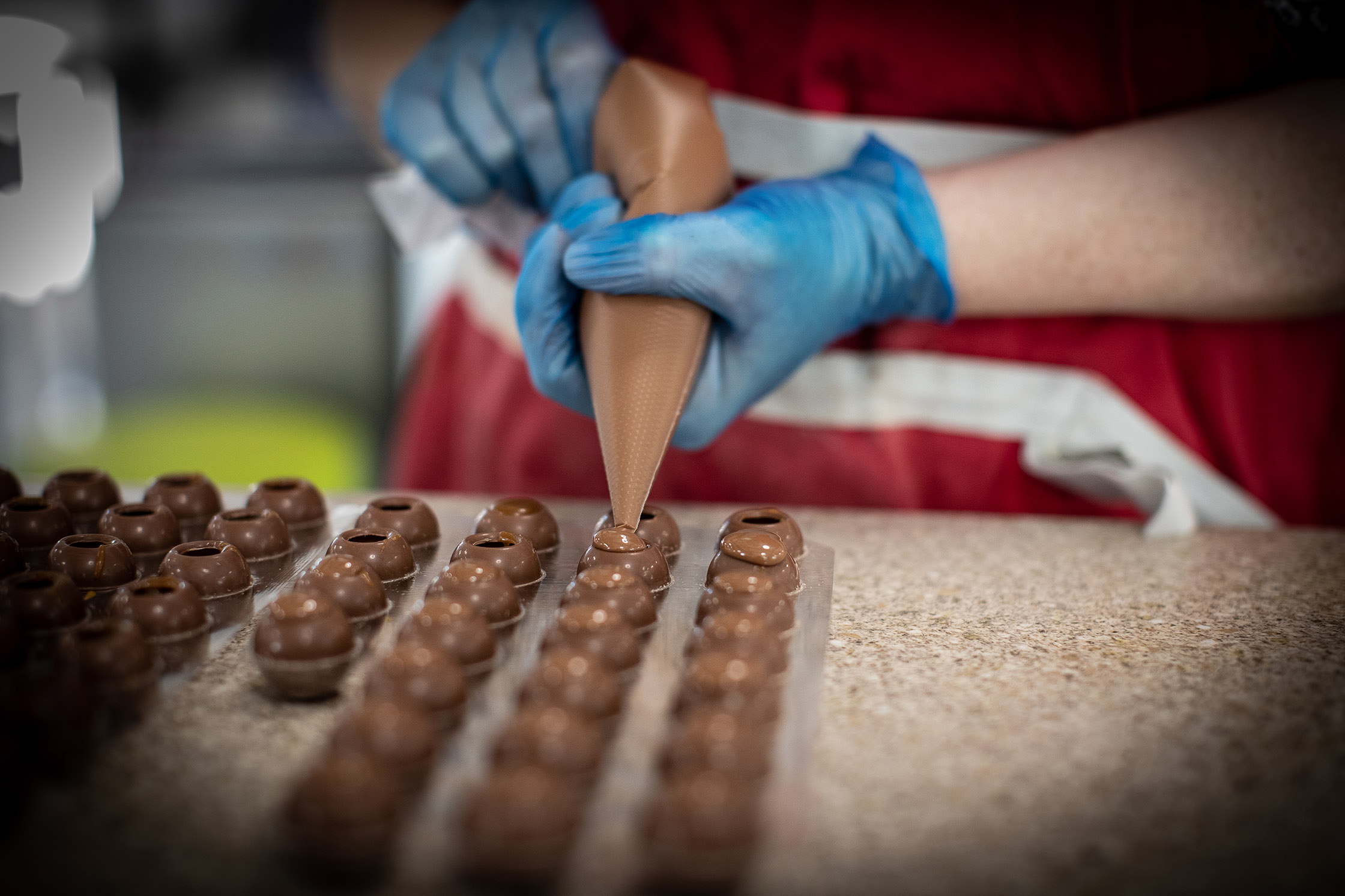 Close up of chocolate being filled by Polly Baldwin Close up of chocolate being filled by Polly Baldwin