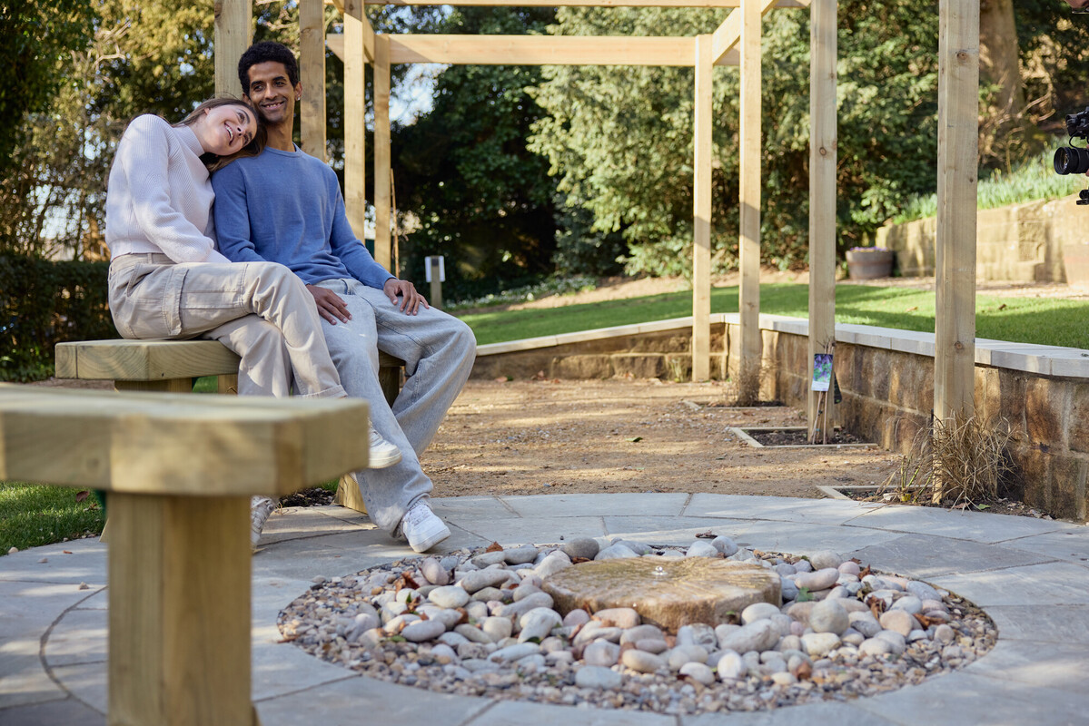 Man and woman sat together contemplating
