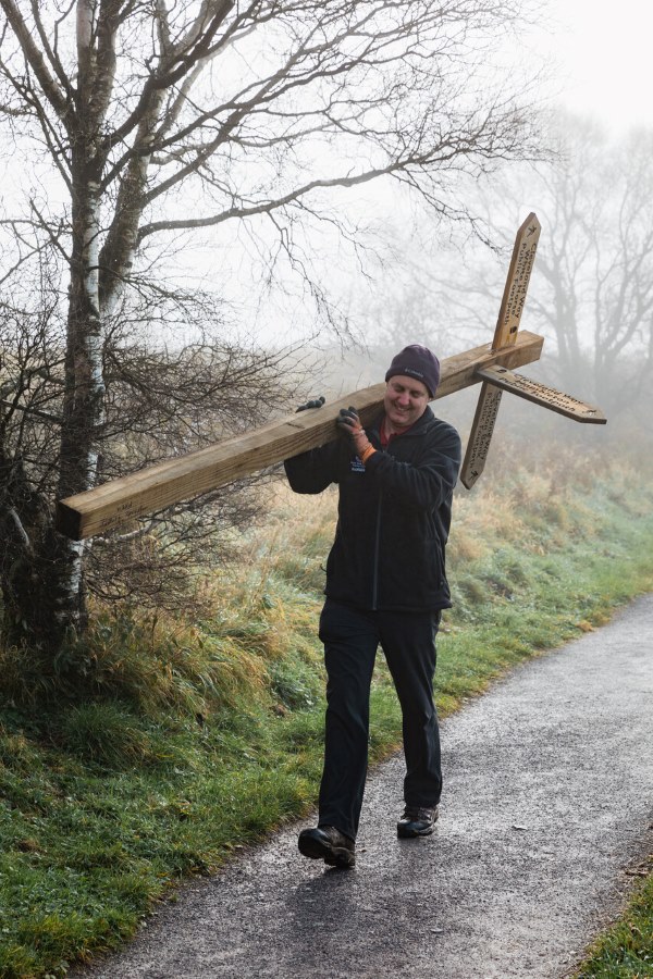 Ranger with waymarker post by Ben Read