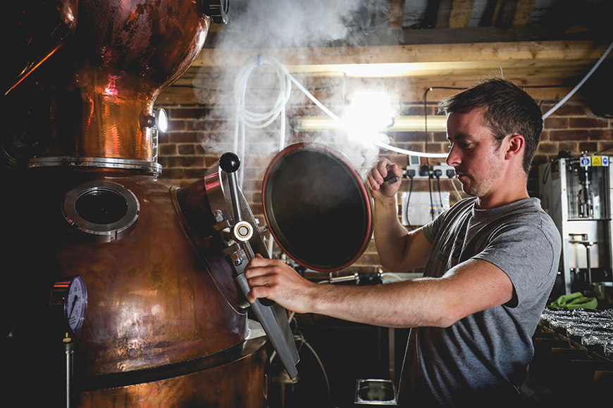 Luke opening distiller door by Ceri Oakes