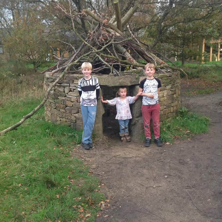 Children outside a natural play area at Sutton Bank.