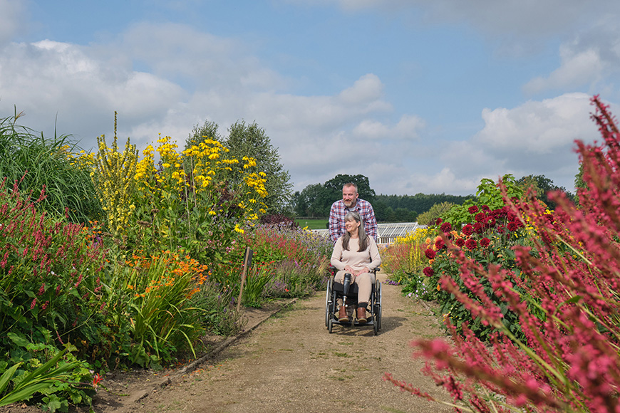 Couple at Helmsley Walled Garden, woman using a wheelchair Credit VisitBritain-Daniel Wildey