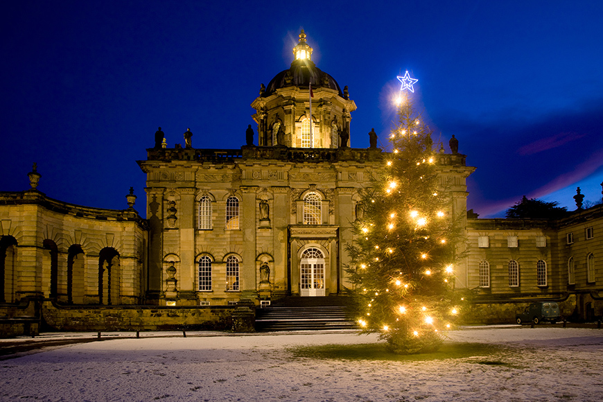 A Christmas tree lit up in front of Castle Howard 