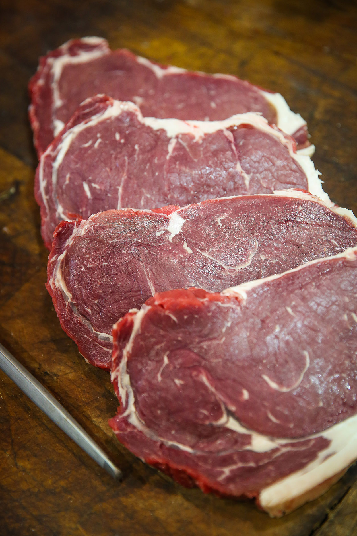 Four raw steak cuts by Ceri Oakes