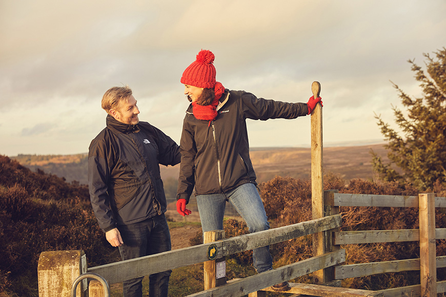 Two people enjoying a winter walk at the Hole of Horcum