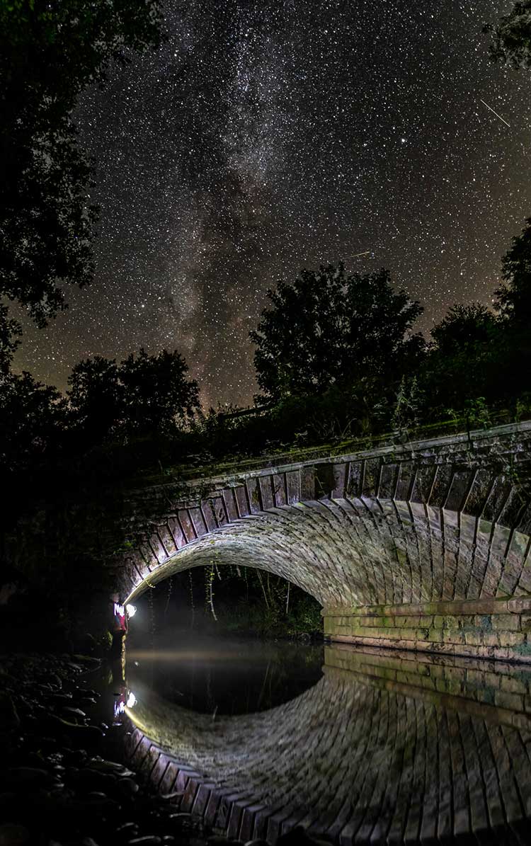Starry skies above a stone bridge. Credit Tom Mutton.