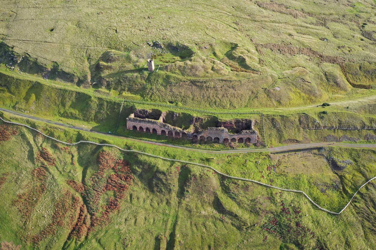 Drone photo of an old industrial kiln structure. Drone photo of an old industrial kiln structure.