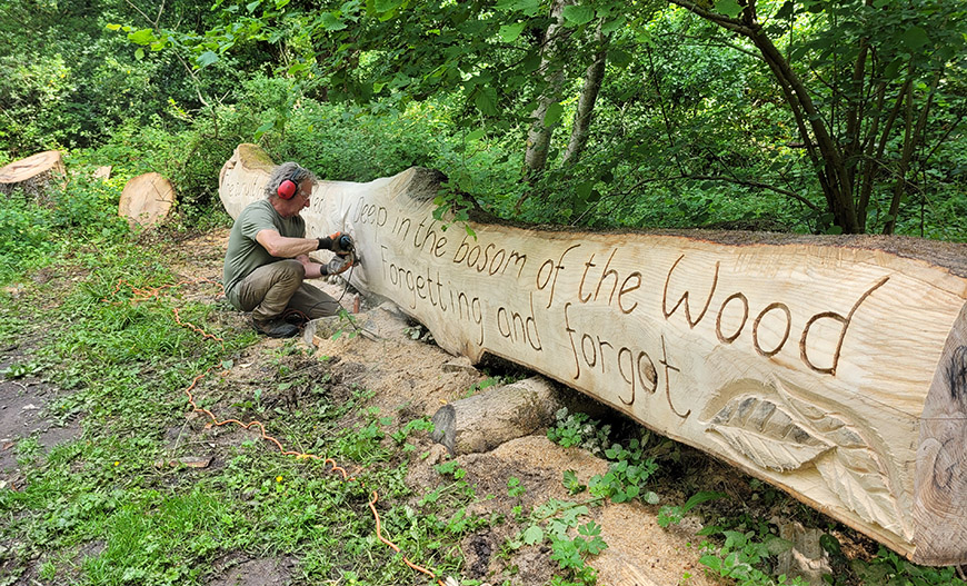 A new wood sculpture on the Coast to Coast, Little Beck with Steve Iredale Credit North York Moors National Park