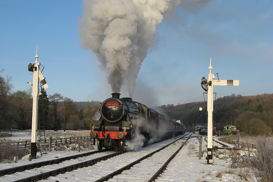 A Santa Special steam train with snow on the track