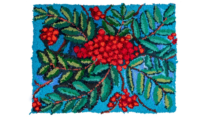 An artwork featuring green leaves and red berries against a blue background.