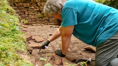 Combs Wood excavation Woman digs with trowel