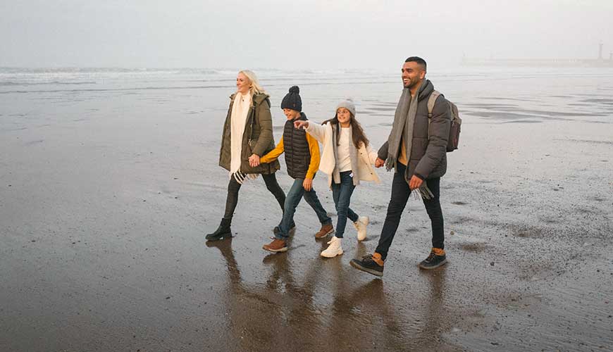 Family walking on a beach