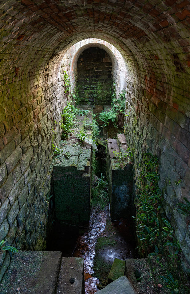 Photo of an arched, stone vault of an old industrial building