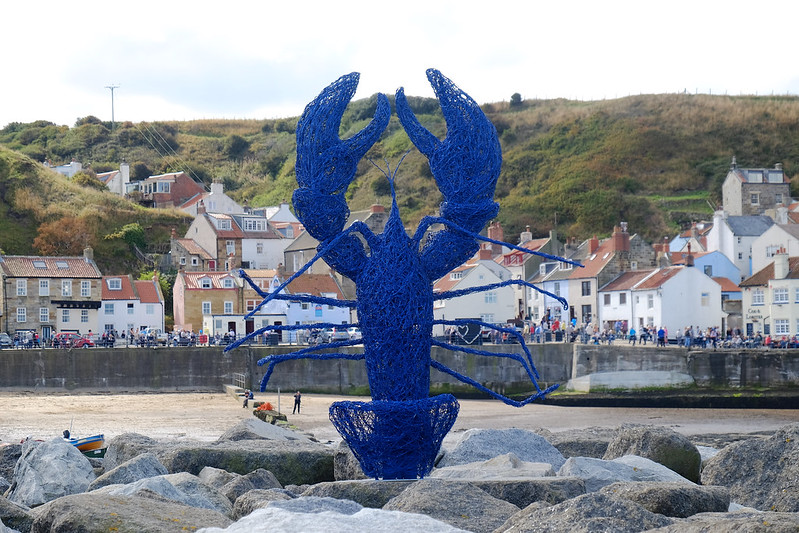 Blue lobster sculpture on the beach at the 2016 Staithes Festival of Arts & Heritage