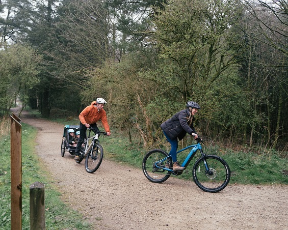 Family cycling with trailer at Sutton Bank by Orillo